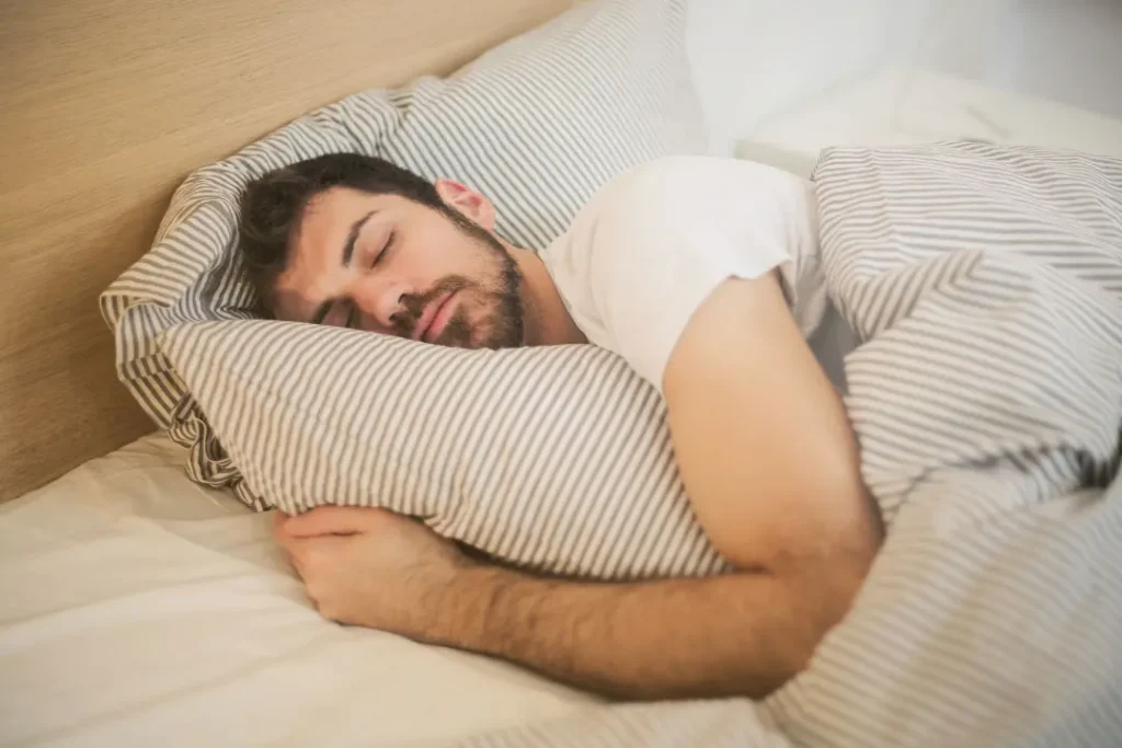 man sleeping on a bed