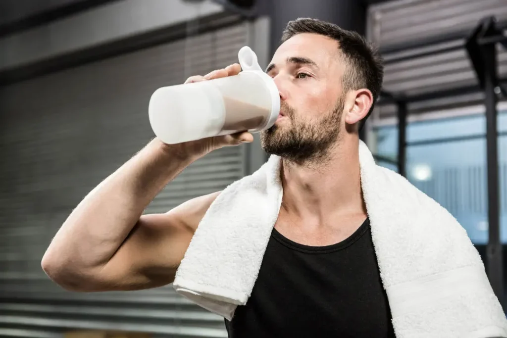 Man having protein drink. 